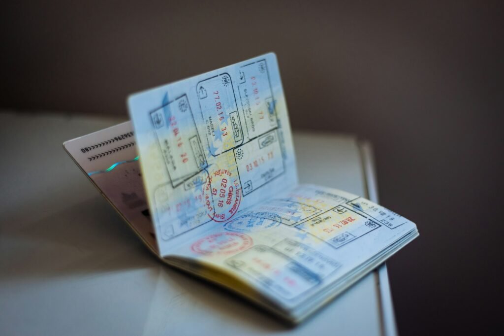 Open passport showing arrival stamps from several countries