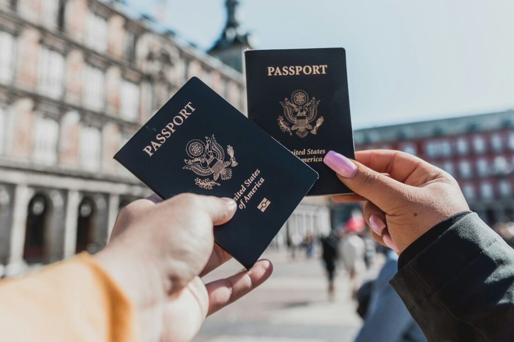 Traveller holding several passports ready for a visa application